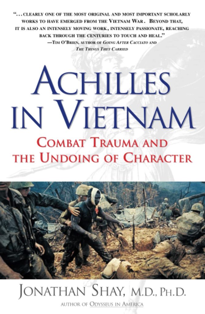 The cover of Jonathan Shay's 1994 work Achilles in Vietnam with the title: "Achilles in Vietnam: Combat Trauma and the Undoing of Character". On it, a soldier with a bloodied bandage around his head moves towards an injured comrade lying covered in mud with his arms outstretched as another soldier tries to hold him back. 